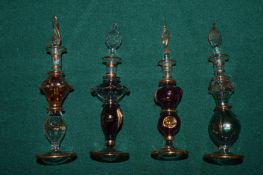 Group of decorative glass scent bottles.