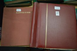 Two stamp albums containing German, European and Swiss stamps.