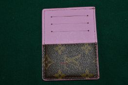 A Louis Vuitton card case, unused.