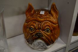 A large pottery bulldog head biscuit jar.