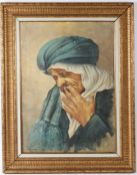 ORIENTALIST SCHOOL Arab man smoking oil on canvas signed indistinctly 69.5 x 49.5cm