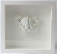 SIR EDUARDO PAOLOZZI (1924-2005) Dragon head plaster relief in glazed case overall 35 x 38cm