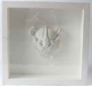 SIR EDUARDO PAOLOZZI (1924-2005) Dragons head plaster relief in glazed case overall 35 x 38cm