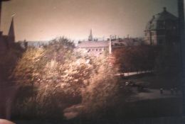 [AUTOCHROMES] Two autochromes, one of two girls bathing and one of a townscape; together with a