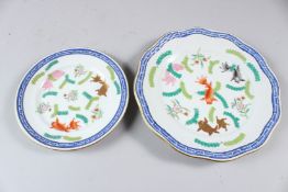 A HEREND PORCELAIN PLATE, with basketweave border, painted with fish and seaweed; together with a