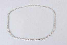 AN 18CT WHITE GOLD AND GRADUATED DIAMOND LINE NECKLACE, approx. 7.5cts.
