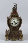 A 19TH CENTURY FRENCH BOULLE MANTLE CLOCK with enamel dial and ormolu mounts. 36cms high.
