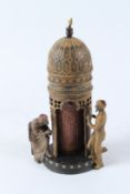 A VIENNA STYLE COLD PAINTED BRONZE GROUP OF ARAB FIGURES BY A TOWER. 30cms high.