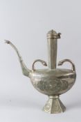 AN ISLAMIC TIN EWER, 20TH CENTURY, with hinged cover, bird form spout, on an octagonal base,