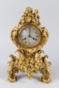 A GOOD 19TH CENTURY FRENCH ROCOCCO ORMOLU MANTLE CLOCK, with eight day movement, silvered dial