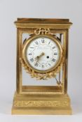 A GOOD 19TH CENTURY FRENCH ORMOLU FOUR GLASS MANTLE CLOCK, with eight day movement, floral decorated
