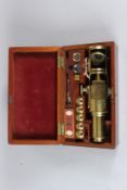 AN EARLY 20TH CENTURY BRASS CULPEPPER TYPE MICROSCOPE, in original fitted box, with accessories.