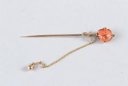 A VICTORIAN 18CT GOLD CORAL STICK PIN.