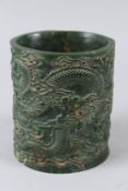 A CHINESE CARVED JADE BRUSHPOT. 15cms high.
