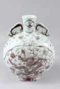ACHINESE PORCELAIN MOON FLASK, painted in sepia tones with dragons. 29cms high.