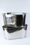 A LARGE PAIR OF POLISHED METAL CHAMPAGNE WINE COOLERS. 65cms wide.