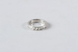 A PLATINUM AND DIAMOND HALF ETERNITY RING set with 1 carat fine quality diamonds.