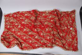 AN OTTOMAN TEPEBASI TEXTILE, red ground with metal thread embroidered decoration. 150cms x 70cms.