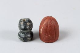 TWO EARLY ISLAMIC, POSSIBLY INDIAN, CARVED STONE GAMING PIECES. 3cms & 3.5cms.
