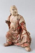 AN 18TH CENTURY CARVED WOOD AND COMPOSITE POLYCHROME DECORATED SEATED BUDDHA. 28cms high.