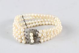 A THREE-ROW CULTURED PEARL BRACELET.
