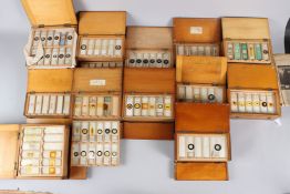A LARGE COLLECTION OF MICROSCOPE SLIDES, boxed.