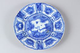 A FINE 17TH-18TH CENTURY PERSIAN SAFAVID GLAZED POTTERY DISH. 23.5cms diameter.