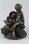 A GOOD 19TH CENTURY BRONZE GROUP, modelled as two tired infants seated on a large sheaf of corn.