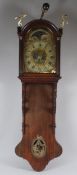 A LATE 19TH CENTURY CONTINENTAL OAK HOODED WALL CLOCK, with thirty hour moonphase movement,