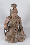 A LARGE LACQUER WOOD FIGURE OF GUANYIN, QING DYNASTY (1644-1912), modelled seated wearing flowing
