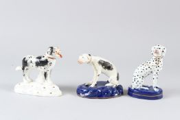 THREE 19TH CENTURY STAFFORDSHIRE POTTERY MODELS OF DOGS. Tallest 13cms high.