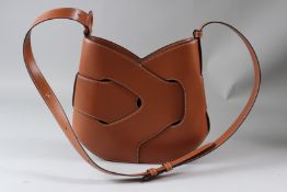 A POLENE LADIES WOVEN TAN LEATHER SHOULDER BAG.