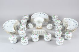 A COLLECTION OF HEREND CORNFLOWER GARLAND PORCELAIN, comprising 14 crescent shaped side plates, 14