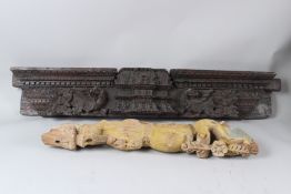 A LETHE 18TH CENTURY INDIAN CARVED WOODEN PANEL, and another carved Yali figure. Panel: 112cms long.