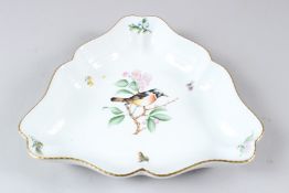 A HEREND PORCELAIN TREFOIL SHAPED DISH, painted with a bird on a flowering branch. 25cms wide.