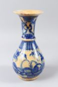 A FINE 18TH CENTURY PERSIAN GLAZED POTTERY VASE. 29cms high.