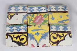 A COLLECTION OF SIX 18TH-19TH CENTURY PERSIAN GLAZED POTTERY TILES. 16cms long.