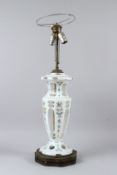 A BOHEMIAN WHITE OPAQUE GLASS VASE SHAPED TABLE LAMP, painted with roses. 73cms high incl. light