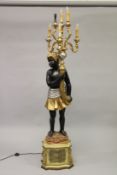 AN ORNATE BLACKAMOOR FIGURAL FLOOR STANDING SIX LIGHT CANDELABRA, on a pedestal base. 195cms high.