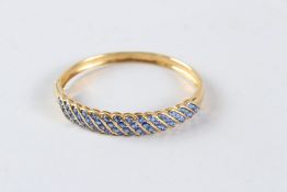 AN 18CT GOLD SAPPHIRE SET BANGLE.