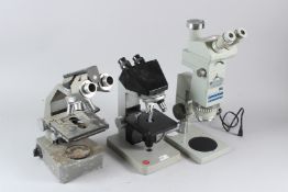 A BANNER SCIENTIFIC LTD BINOCULAR MICROSCOPE, A LEITZ BINOCULAR MICROSCOPE, and another similar (