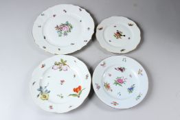 FOUR HEREND PORCELAIN PLATES, various designs and sizes. 19cms, 20cms, 22cms and 26.5cms.