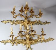 A PAIR OF ORMOLU FIVE-LIGHT WALL APPLIQUES, each with scrolling branches and similar backplate.