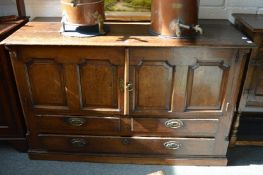 AN 18TH CENTURY OAK MULE CHEST, with a planked top, pair of panelled doors above two short and one