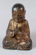 A CHINESE GILT BRONZE BUDDHA. 22.5cms high.
