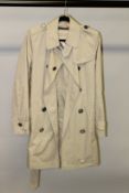 A BURBERRY TRENCH COAT.