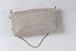AN ESCADA LADIES DIAMANTE EVENING BAG with dust cover.