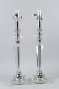 A PAIR OF STYLISH ART DECO STYLE CUT GLASS TABLE LAMPS. 53cms high.