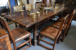 AN 18TH CENTURY OAK REFECTORY DINING OR SIDE TABLE, with a cleated plank top, partially carved