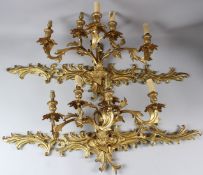 A PAIR OF ORMOLU FIVE-LIGHT WALL APPLIQUES, each with scrolling branches and similar backplate.